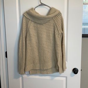 Beige sweater.